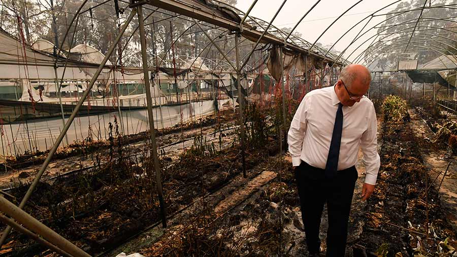 Australian PM Scott Morrison at a damaged flower farm