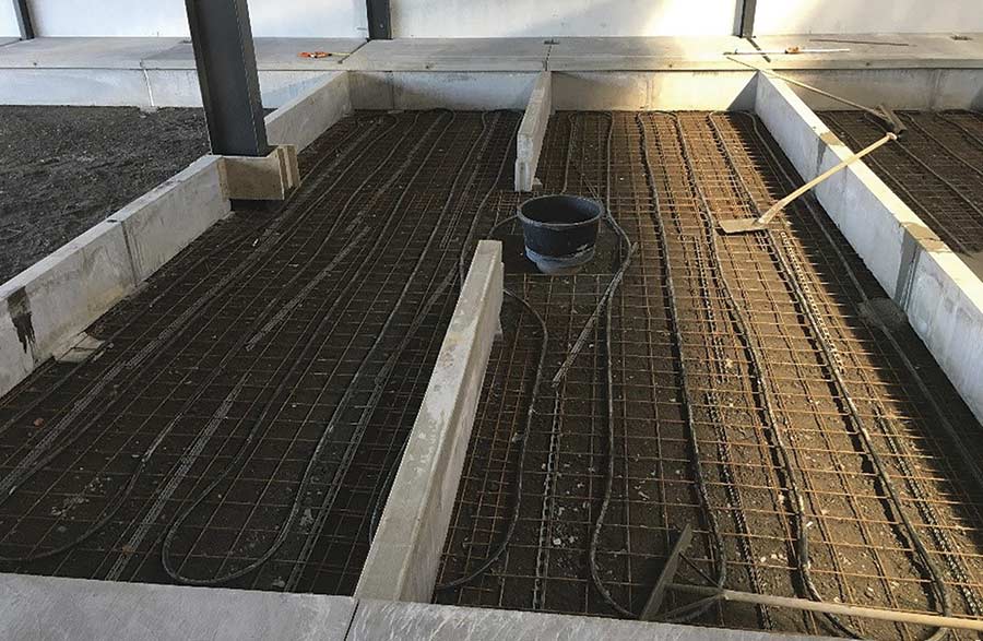 piping being laid on concrete floor
