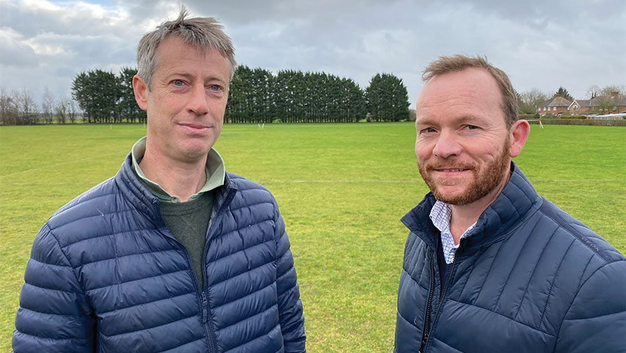 Ralph Parker and Matt Doggett standing in a field