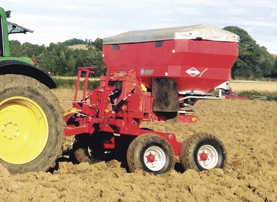 Fertiliser spreader in a field