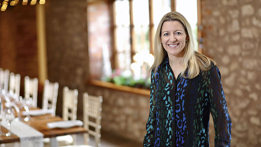 Naomi Hansford inside a barn dining room