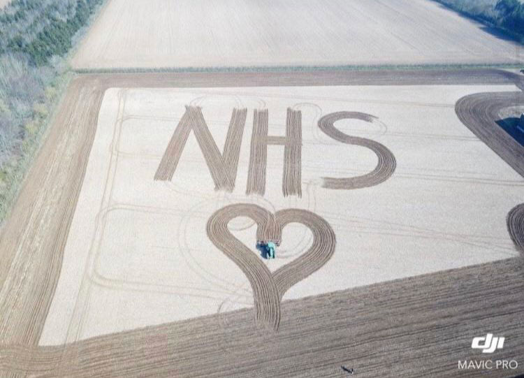 NHS and heart mowed into field