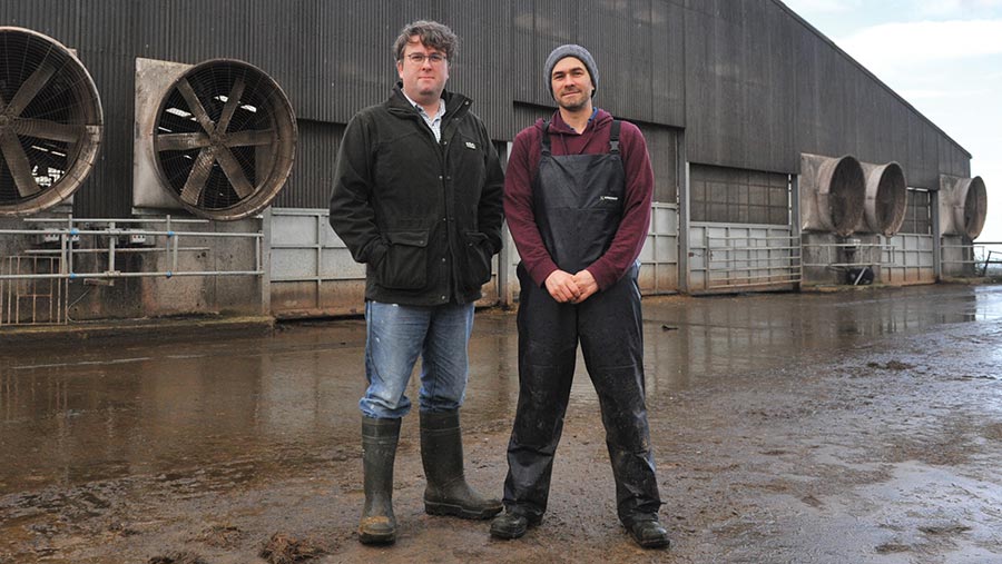 Tom (left) and Marc Allison in the dairy shed