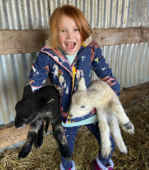 Girl with lambs