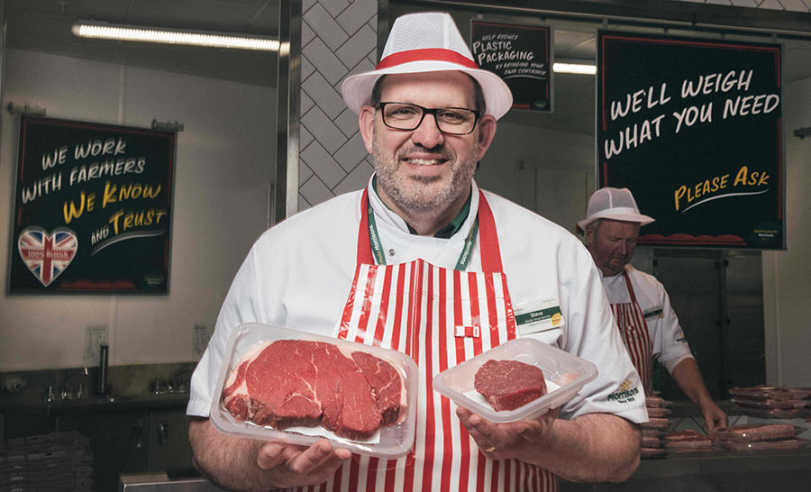 Morrisons butcher holding a roasting joint