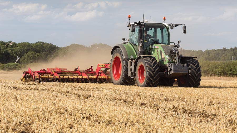 Tractor cultivating field