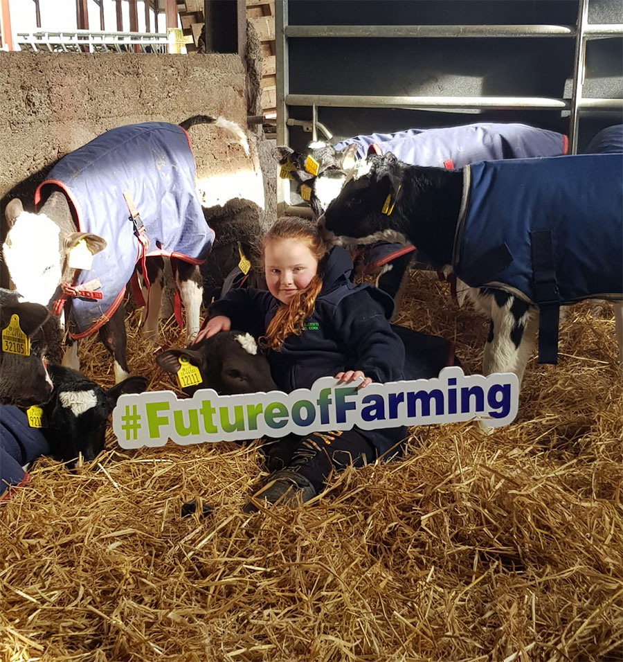 Georgina Hynes with calves in shed