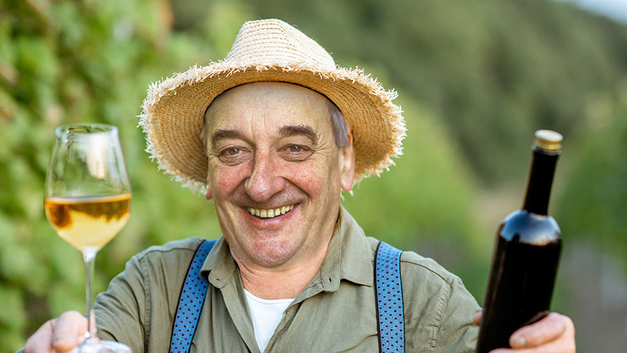 Raymond with wine and hat