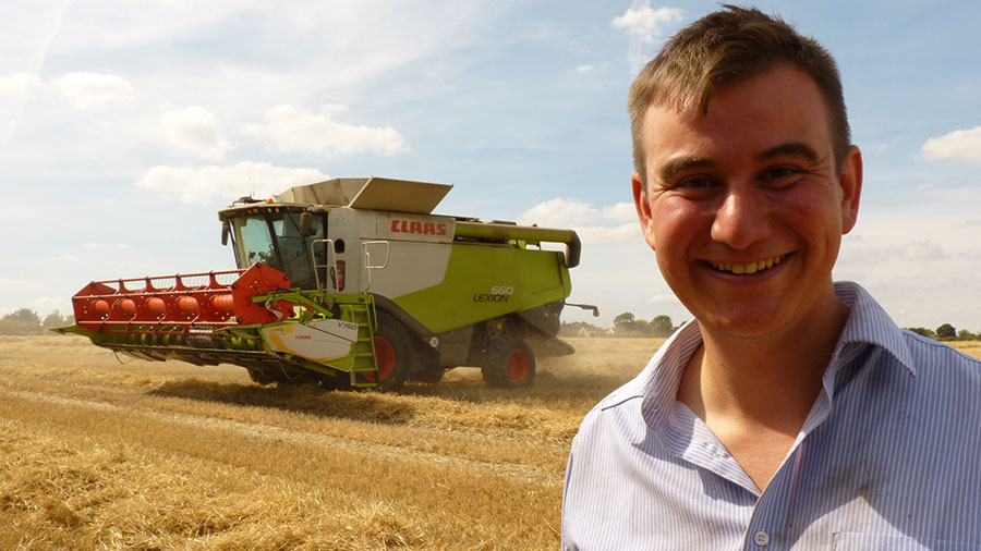 George Young with combine in the background