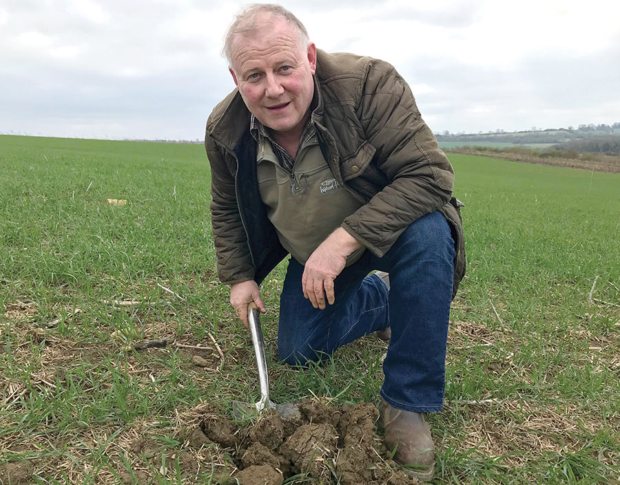 Phil Jarvis digging in soil