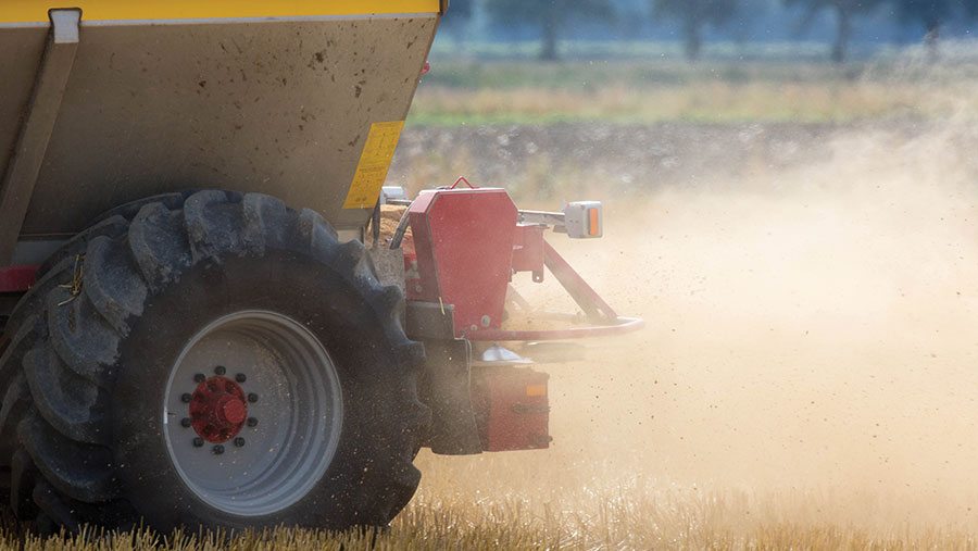 Spreading lime on a field