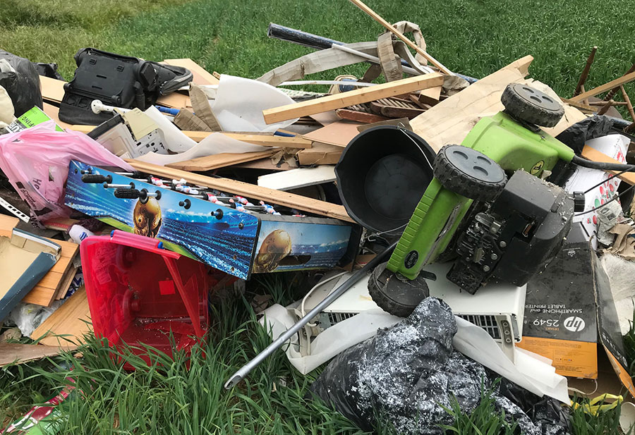 Flytipped waste in field