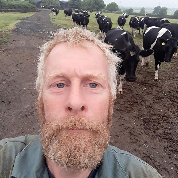 Rich Cornock with cows in background