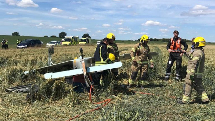 Fireman in field with plane