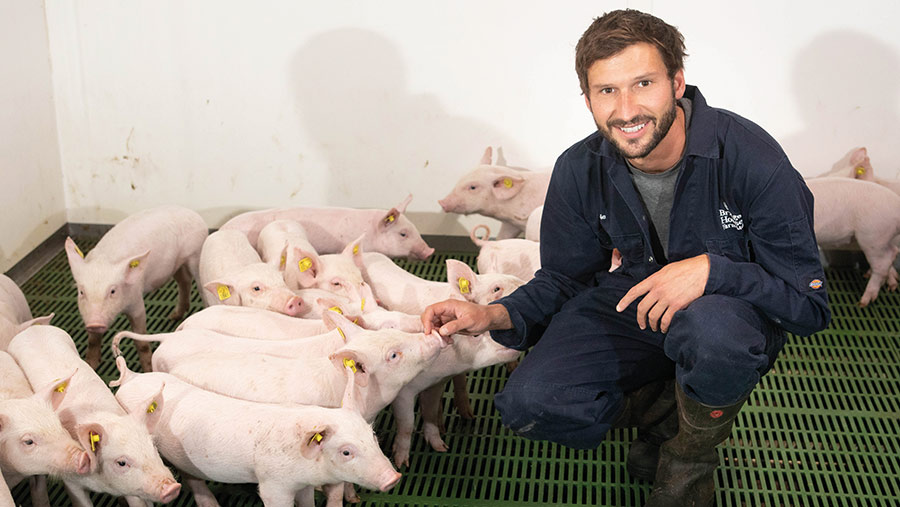 Charlie Thompson in pig shed