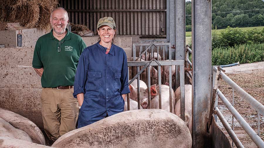 Stephen and Karen Thompson in pig shed