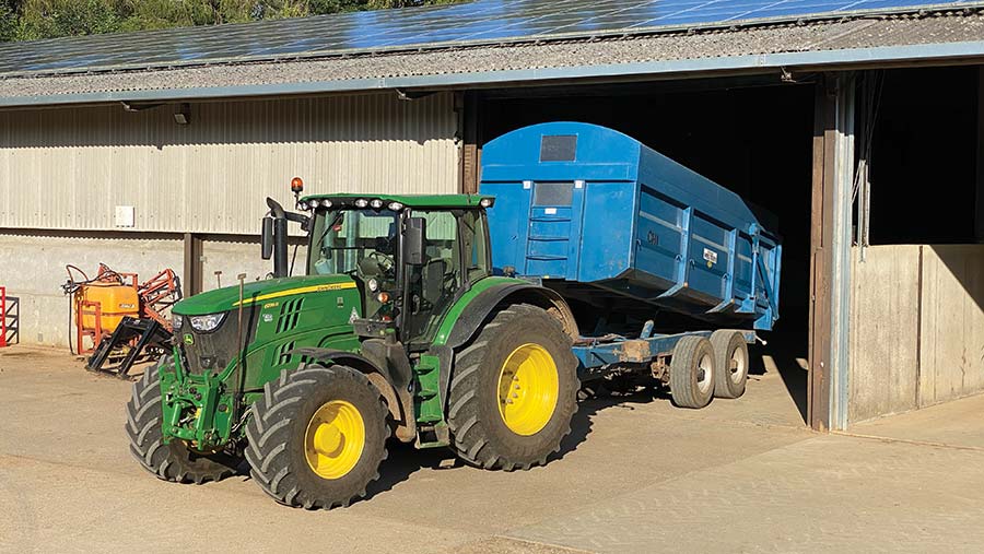 Tractor and trailer in yard