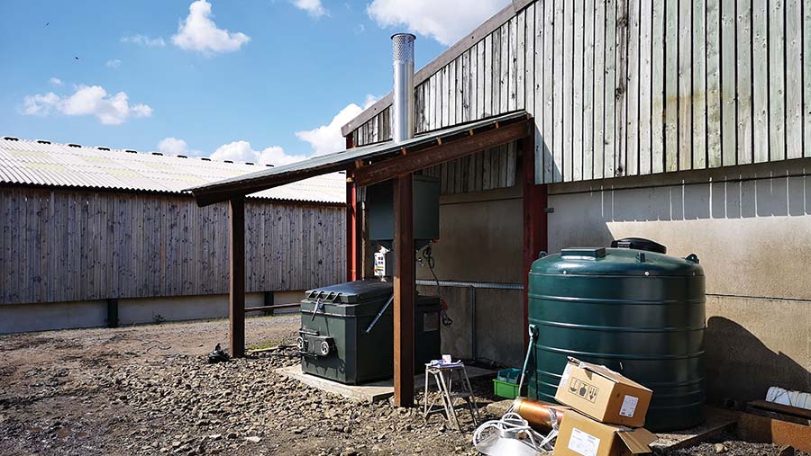 Incinerator positioned under shelter