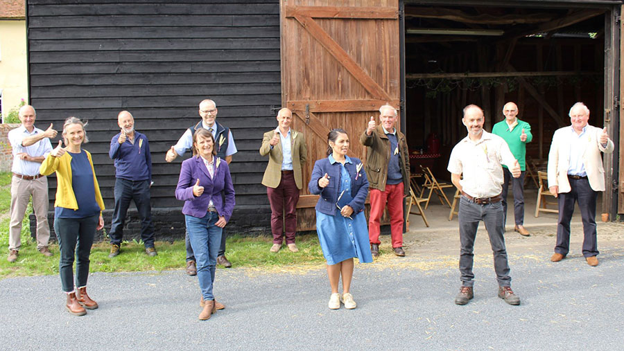 Priti Patel MP with Essex farmers giving a thumbs up to Back British Farming Day