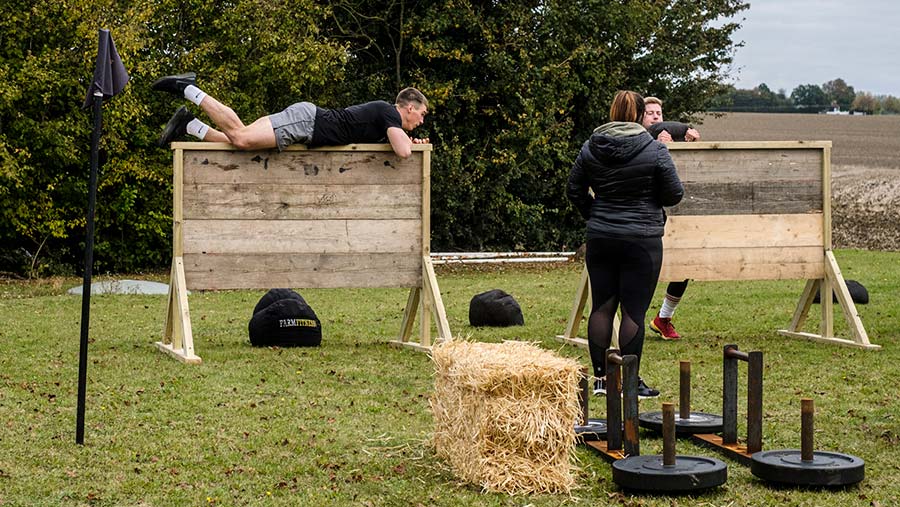 James Arney jumps a wall in the final leg of the competition © Colin Miller/MAG