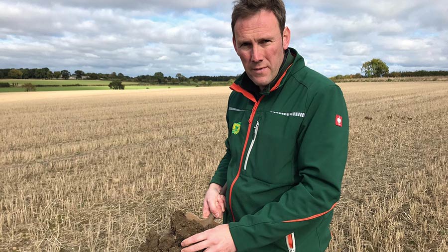 Andrew Yarrow holding soil