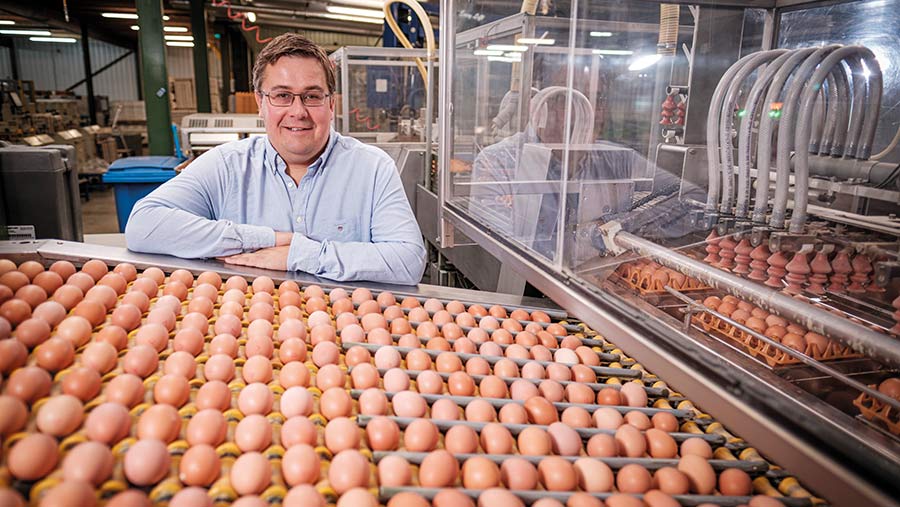 Tom Elliott in shed with eggs