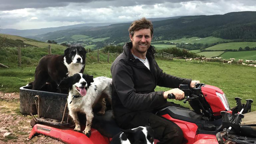 David Knight on quad bike with dogs