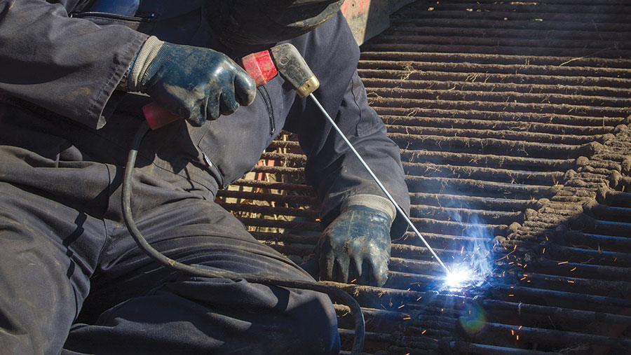 Man welding on roof