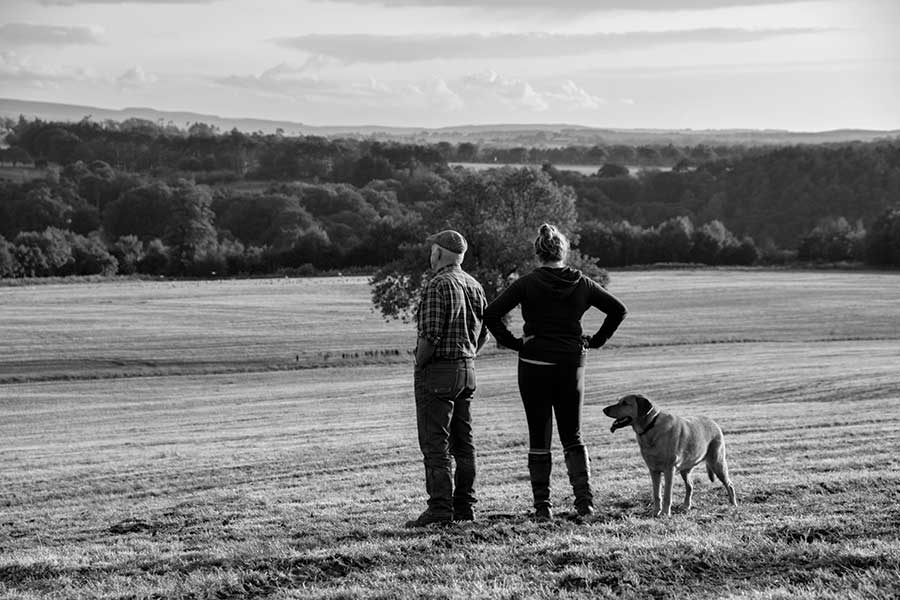 Father and daughter in a field