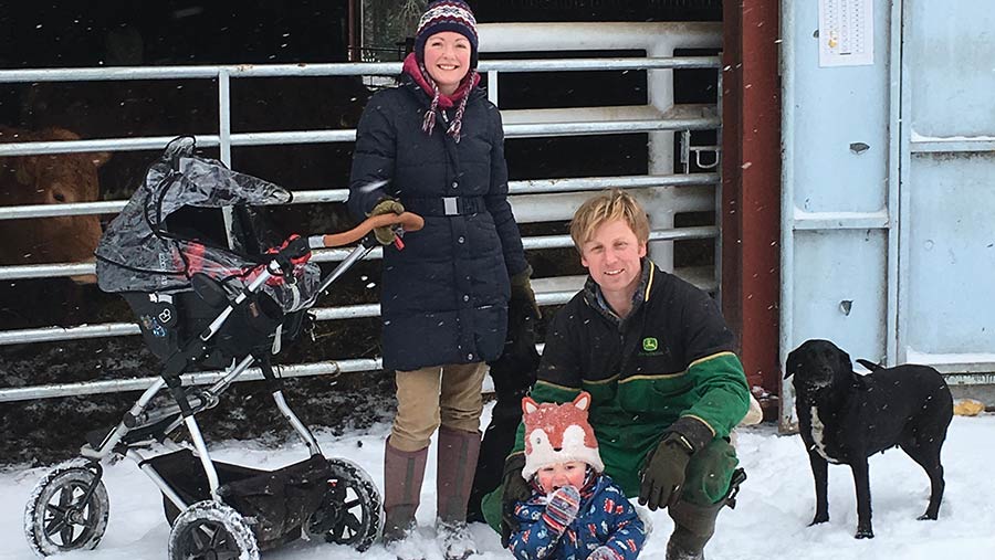 Neil and Susanna Harley with their son, Rollo, and dog in the snow