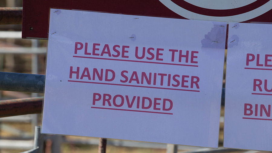 Printed sign reads: Please use the hand sanitiser provided