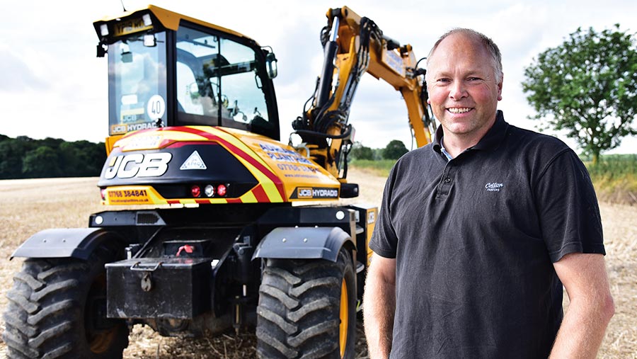 Adrian Patrick in front of JCB Hydradig