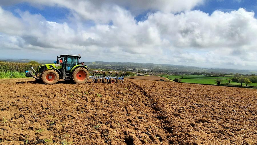Tractor ploughing field