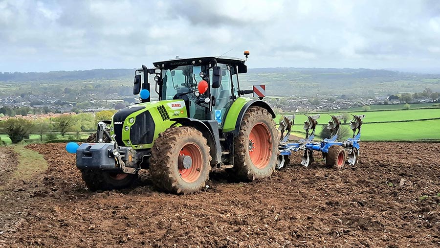 Tractor ploughing field