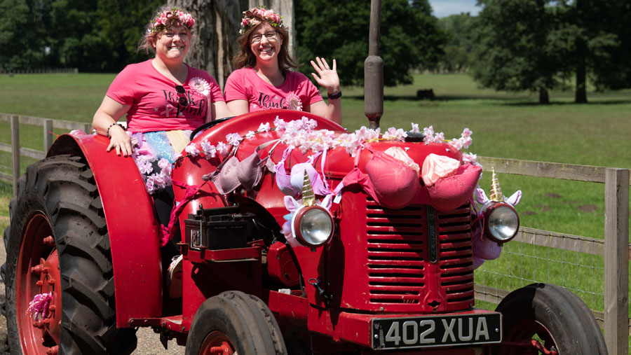 Women in decorated red tractor