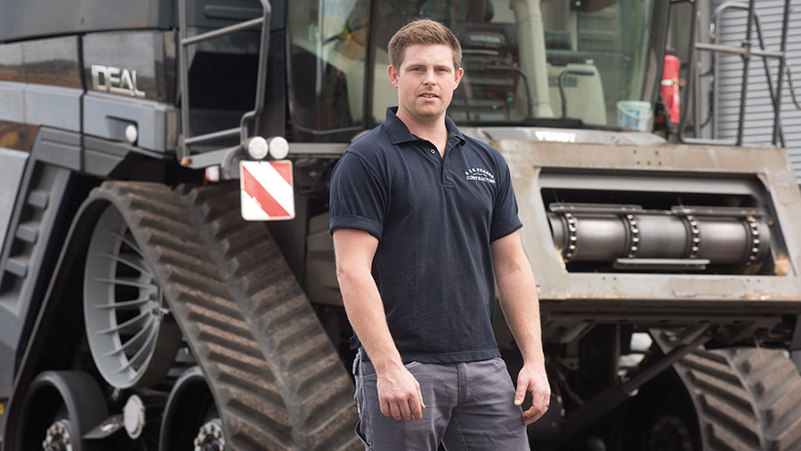 George Fraser in front of tractor