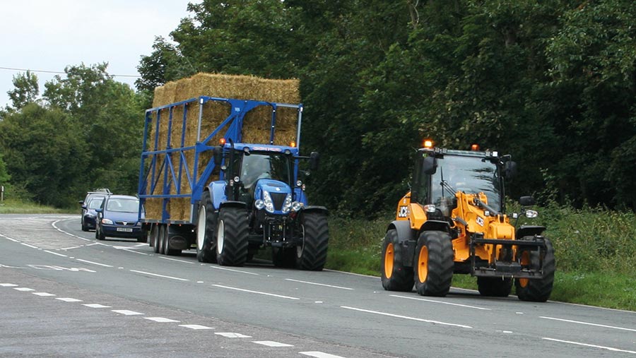 JCB leads the tractor and trailer on a public road