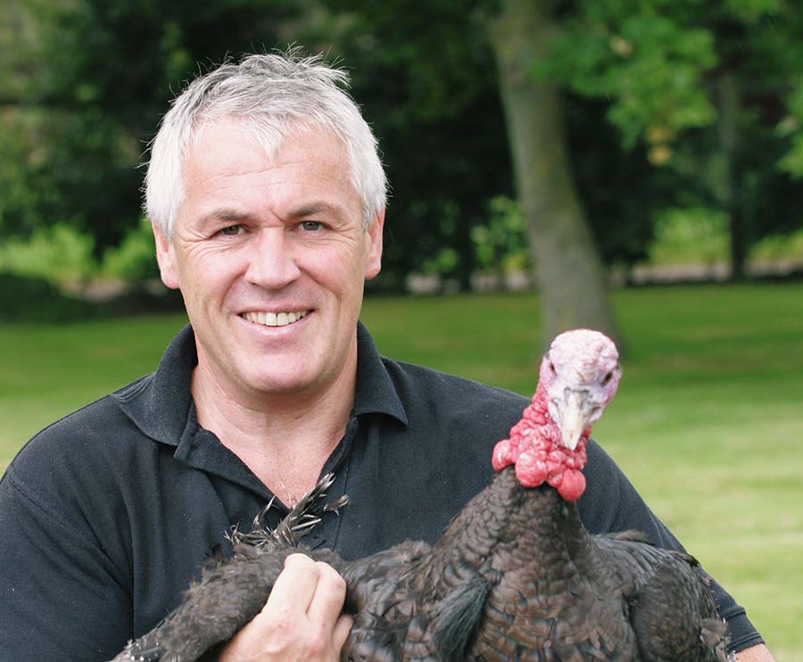 Paul Kelly holding a turkey