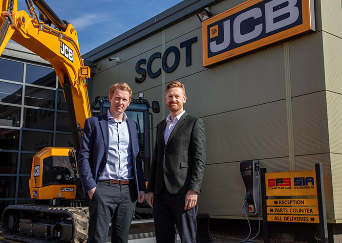 Scot JCB dealership employees outside dealership