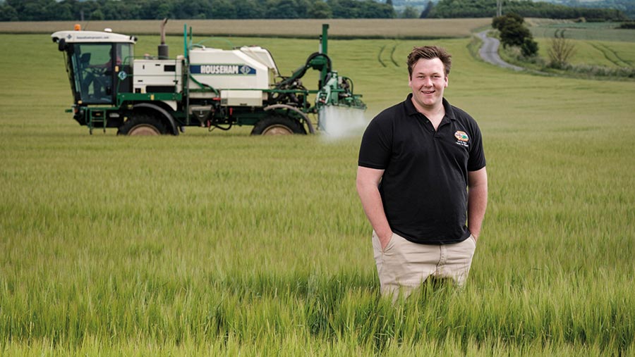 Ben Clappison in a field with a sprayer