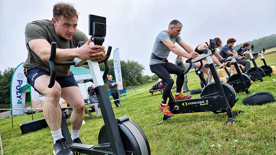 Britain's Fittest Farmer competitors on exercise bikes