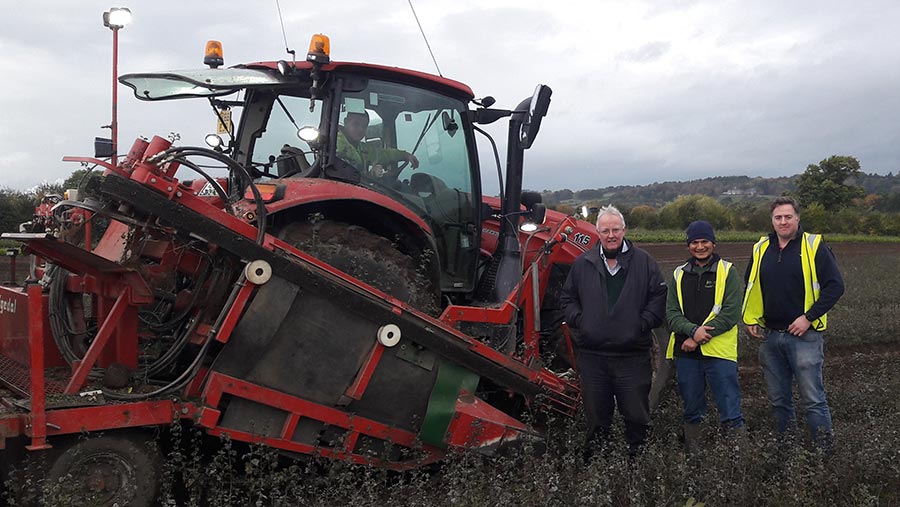 Charles Beaumont and staff with tractor