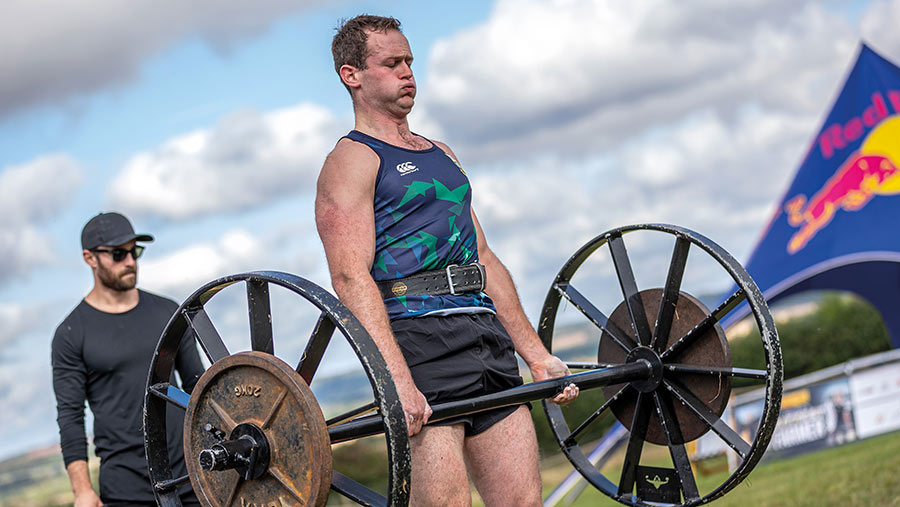 John Carlisle lifting weights