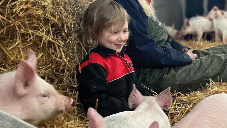 Mabel Broughton with pigs