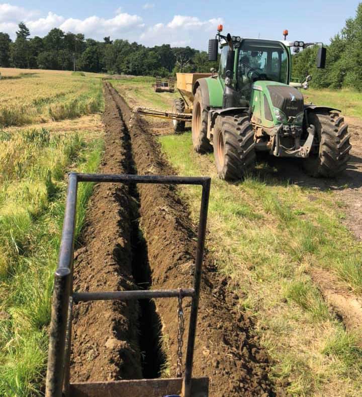 Drainage ditch and tractor