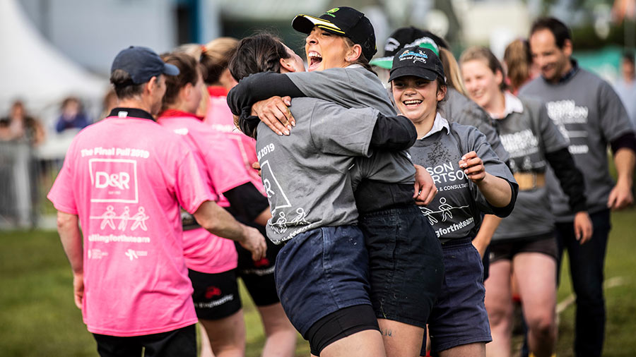 Scottish young farmers celebrating after a Tug of War win at Scottish Association of Young Farmers Club© SAYFC