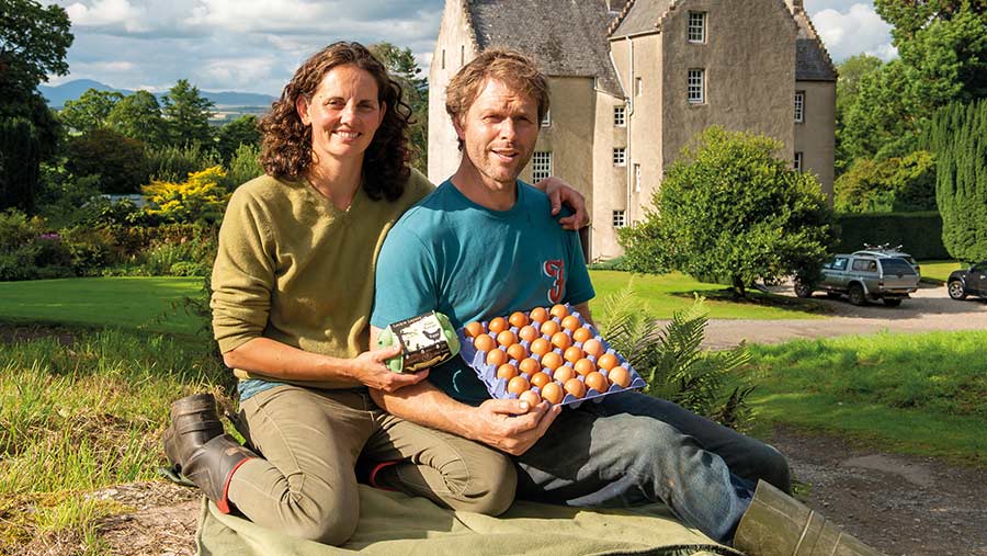 Alison and Fergus Younger sitting with box of eggs