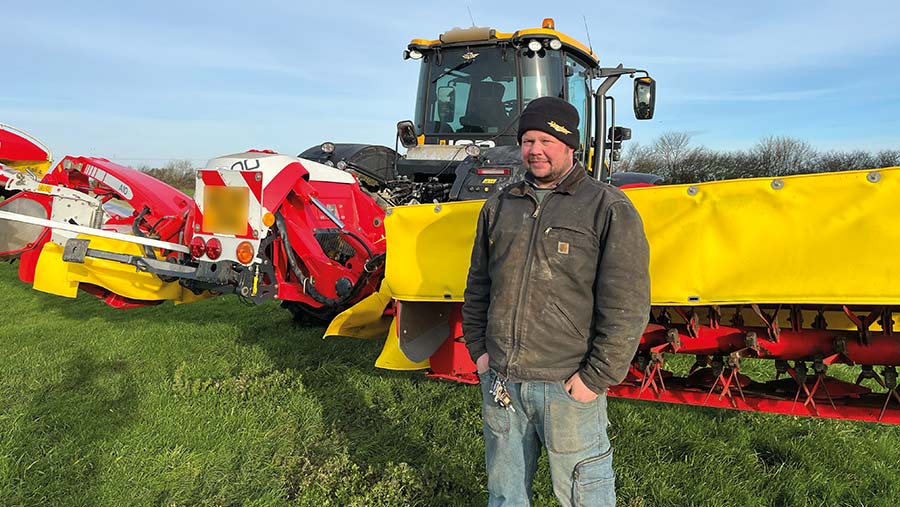 Andrew Lawman in field with mower