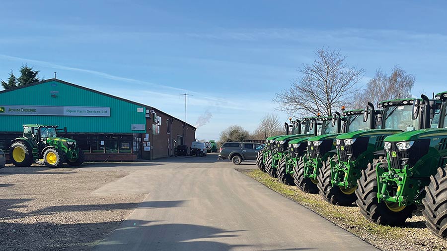Exterior of dealship with row of tractors