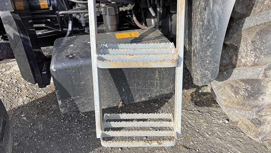 Basic metal steps on tractor